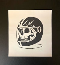 a black and white print of a skull in a helmet