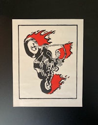 a sticker of a motorcycle with flames on it